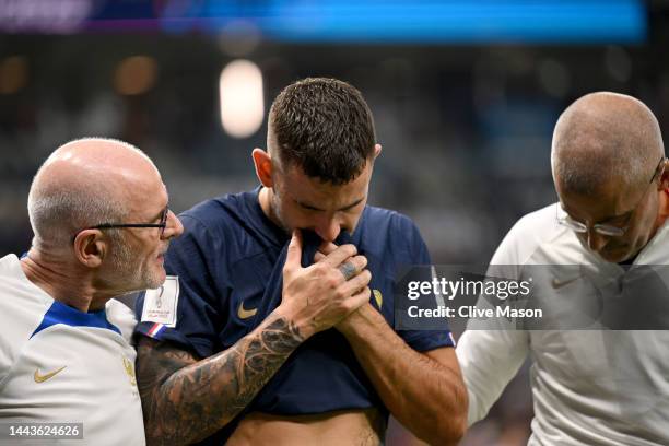 Lucas Hernandez of France is attended by medical staffs as he is substituted after an injury during the FIFA World Cup Qatar 2022 Group D match...