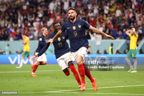 Olivier Giroud of France celebrates scoring his side's second goal with their teammate Ousmane Dembele during the FIFA World Cup Qatar 2022 Group D...