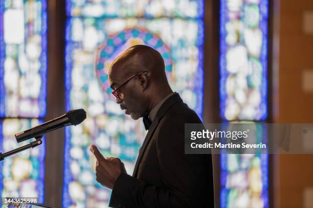 black congregation attend black baptist church service - vicar stock pictures, royalty-free photos & images