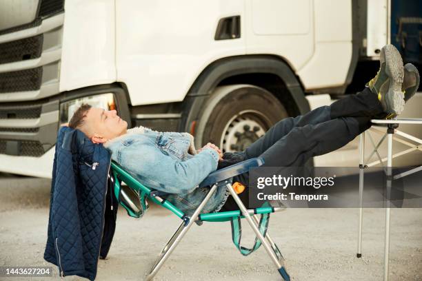 nap time for tired truck driver after long journey - feet on table stock pictures, royalty-free photos & images