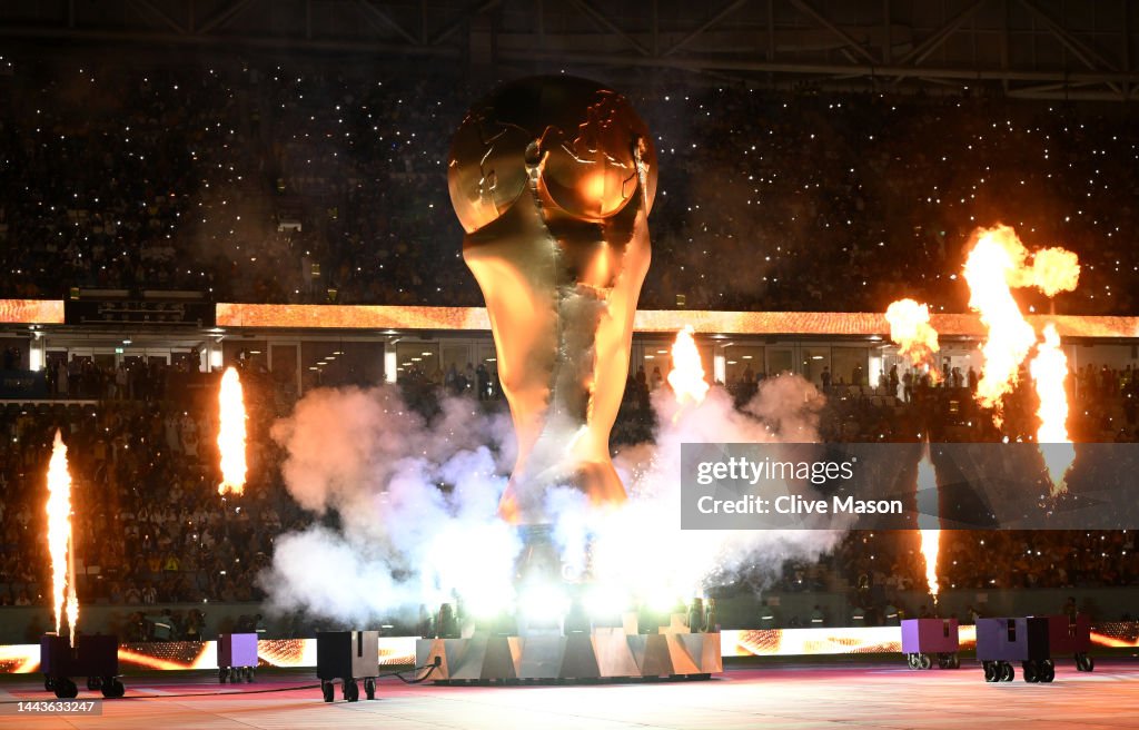 Exploding Trophy Pyrotechnics explode around a giant FIFA World Cup trophy prior to ...