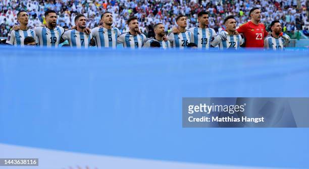 Team Argentina with Lionel Messi of Argentina sing their national anthem prior to the FIFA World Cup Qatar 2022 Group C match between Argentina and...