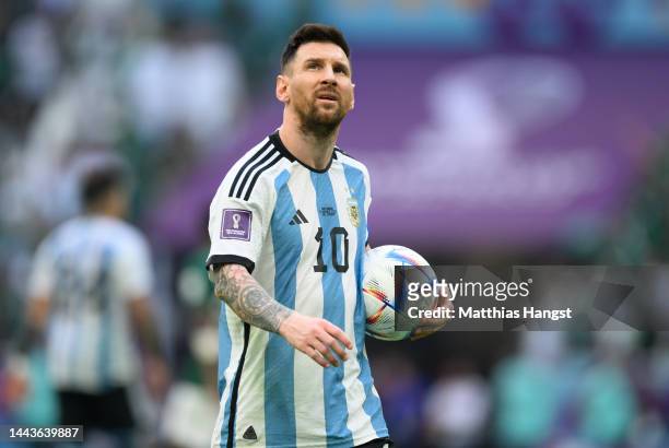 Lionel Messi of Argentina holds an Adidas ball during the FIFA World Cup Qatar 2022 Group C match between Argentina and Saudi Arabia at Lusail...