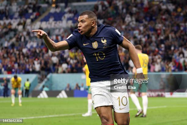 Kylian Mbappe of France celebrates after scoring their team's third goal past Harry Souttar of Australia during the FIFA World Cup Qatar 2022 Group D...