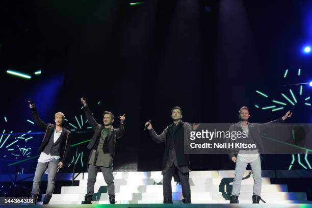 Kian Egan, Shane Filan, Mark Feehily and Nicky Byrne of Westlife performs on stage at Motorpoint Arena on May 13, 2012 in Sheffield, United Kingdom.