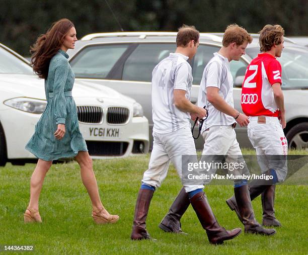 Catherine, Duchess of Cambridge, Prince William, Duke of Cambridge and Prince Harry attend the Audi Polo Challenge charity polo match, in which...