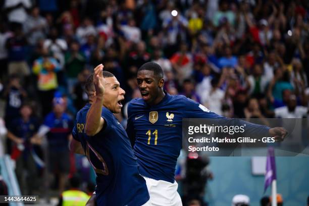 Kylian Mbappe of France celebrates after scoring his team's third goal with Ousmane Dembele during the FIFA World Cup Qatar 2022 Group D match...