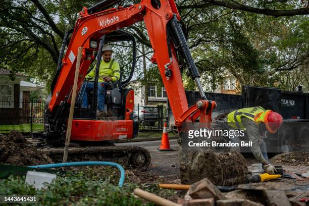 Construction workers work on repairing a street on November 22, 2022 in Houston, Texas. The White House's infrastructure plan estimates to set aside...