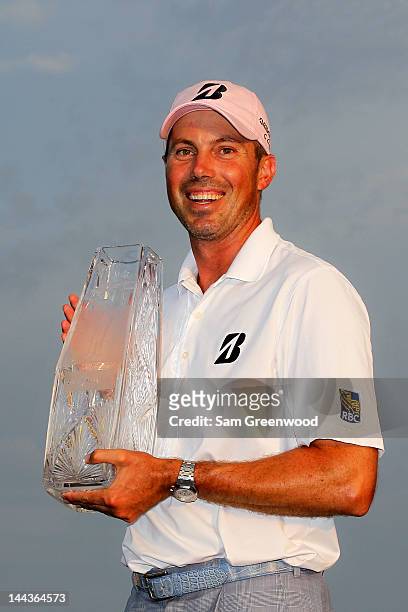 Matt Kuchar of the United States celebrates with the trophy after his two-stroke victory during the final round to win THE PLAYERS Championship held...