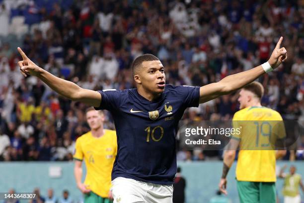 Kylian Mbappe of France celebrates after scoring their team's third goal past Harry Souttar of Australia during the FIFA World Cup Qatar 2022 Group D...