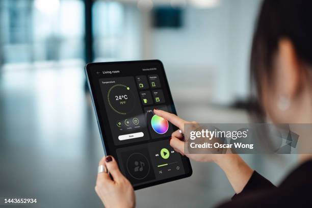 controlling smart electronic appliances with smart digital dashboard control on digital tablet - empty office one person stock pictures, royalty-free photos & images