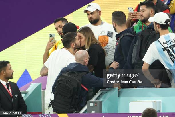 Theo Hernandez of France kisses his partner Zoe Cristofoli after the FIFA World Cup Qatar 2022 Group D match between France and Australia at Al...