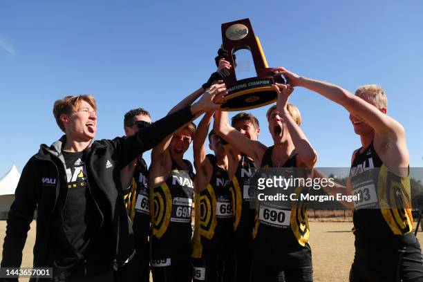 The Northern Arizona Lumberjacks celebrates after winning the Division I Men’s Cross Country Championship on November 19, 2022 in Stillwater,...