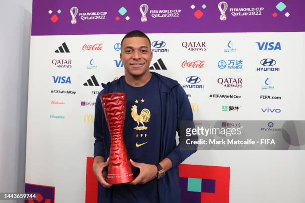 Kylian Mbappe of France poses with the Budweiser Player of the Match Trophy following the FIFA World Cup Qatar 2022 Group D match between France and...