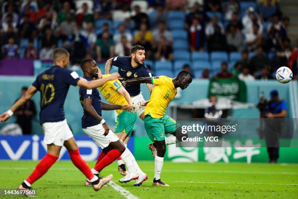 Theo Hernandez of France jumps to head the ball during the FIFA World Cup Qatar 2022 Group D match between France and Australia at Al Janoub Stadium...