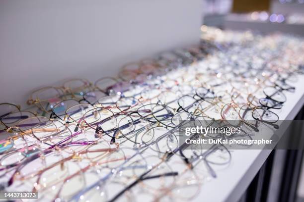 glasses store - visual china group fotografías e imágenes de stock