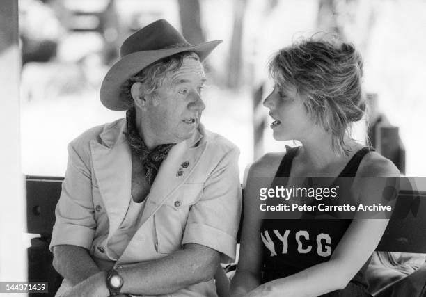 Actors John Meillon and Linda Kozlowski on the set of their new film 'Crocodile Dundee' in 1986 on location in the Northern Territory, Australia.