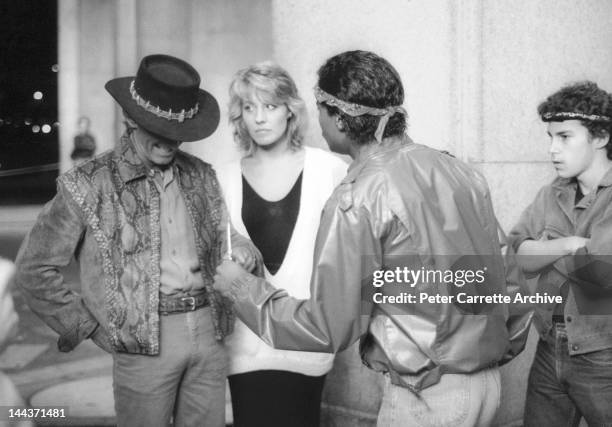 Actors Paul Hogan, Linda Kozlowski and Tony Holmes on the set of their new film 'Crocodile Dundee' in 1986 in New York City.