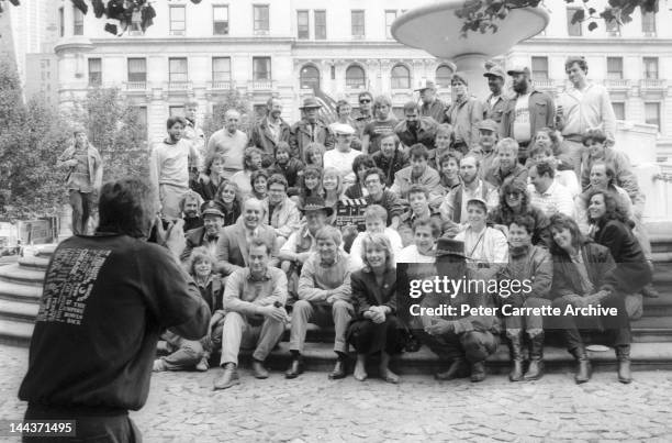 Actors Paul Hogan and Linda Kozlowski pose with the cast and crew on the set of their new film 'Crocodile Dundee' in 1986 in New York City.