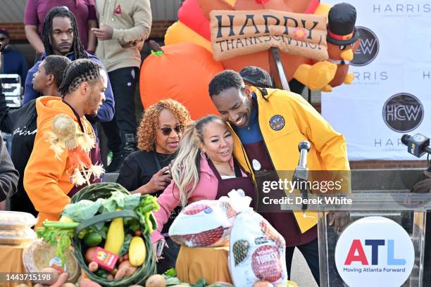 Violeta Morgan, Tameka "Tiny" Harris, and Mayor of Atlanta Andre Dickens attend Harris Community Works 17th Annual Turkey Drive at Jackson Memorial...