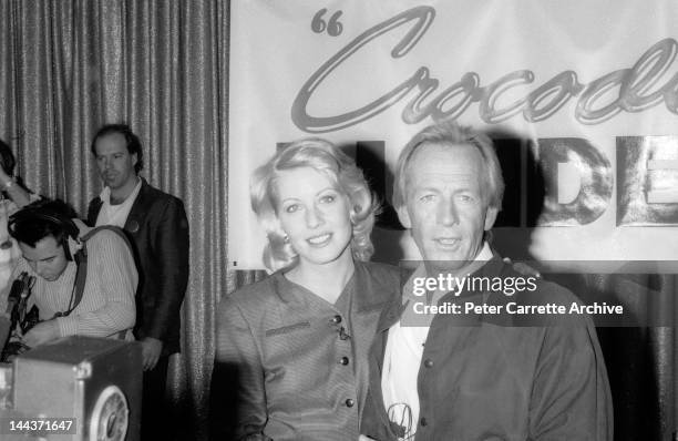 Actors Linda Kozlowski and Paul Hogan attend a press conference to promote their new film 'Crocodile Dundee II' in 1988 in Sydney, Australia.