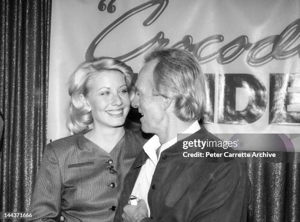 Actors Linda Kozlowski and Paul Hogan attend a press conference to promote their new film 'Crocodile Dundee II' in 1988 in Sydney, Australia.