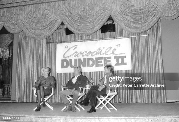 Actors Linda Kozlowski and Paul Hogan attend a press conference to promote their new film 'Crocodile Dundee II' in 1988 in Sydney, Australia.