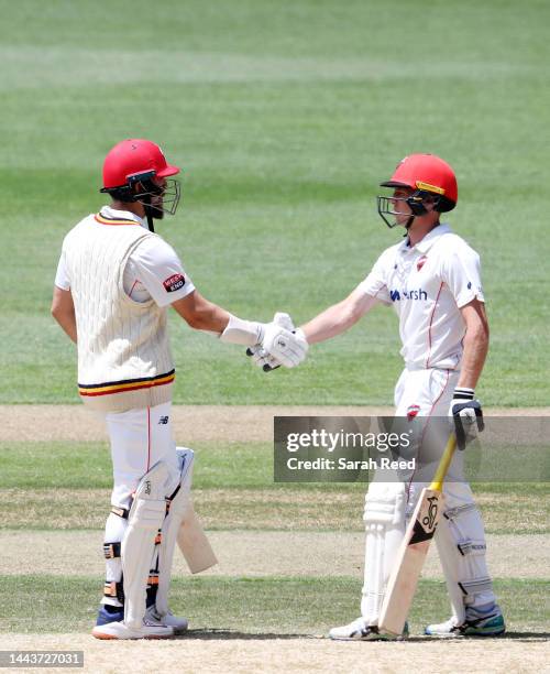 Jake Lehmann of the Redbacks being congratulated by Nathan McSweeney of the Redbacks on his 50th run during the Sheffield Shield match between South...