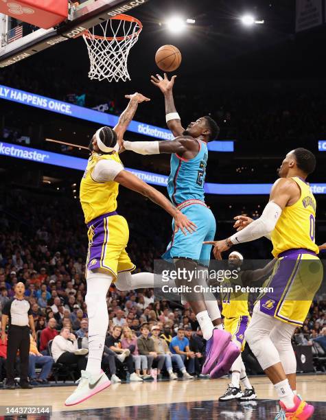 Deandre Ayton of the Phoenix Suns puts up a shot over Anthony Davis of the Los Angeles Lakers during the first half of the NBA game at Footprint...