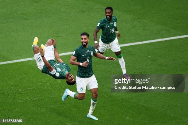Salem Aldawsari of Saudi Arabia celebrates as he scores the goal with Saleh Alshehri of Saudi Arabia and Nawaf Alabid of Saudi Arabia during the FIFA...