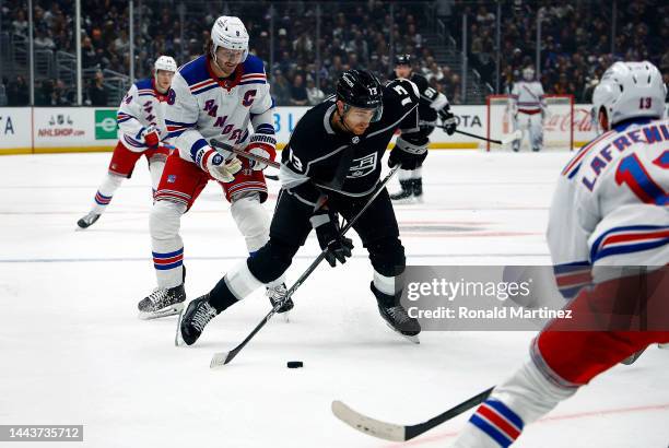 Gabriel Vilardi of the Los Angeles Kings skates the puck against Jacob Trouba of the New York Rangers in the first period at Crypto.com Arena on...