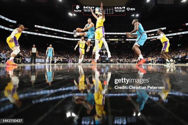 Devin Booker of the Phoenix Suns drives to the basket against Anthony Davis of the Los Angeles Lakers during the second half of the NBA game at...