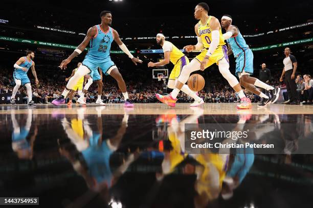 Russell Westbrook of the Los Angeles Lakers handles the ball against Deandre Ayton of the Phoenix Suns during the second half of the NBA game at...