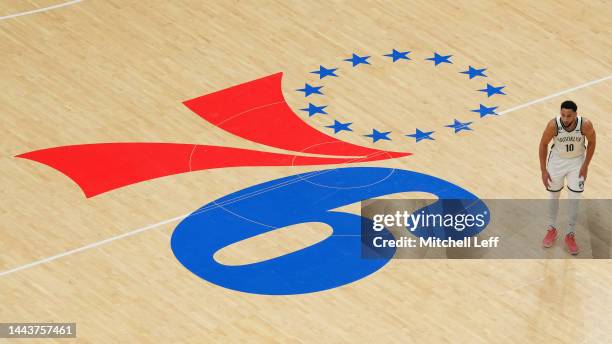 Ben Simmons of the Brooklyn Nets looks on past the center court logo of the Philadelphia 76ers at the Wells Fargo Center on November 22, 2022 in...