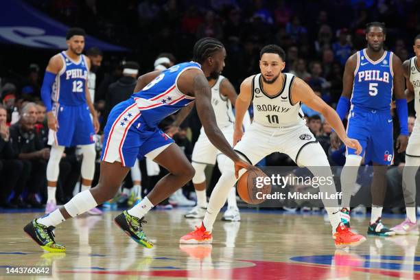 Ben Simmons of the Brooklyn Nets guards Shake Milton of the Philadelphia 76ers at the Wells Fargo Center on November 22, 2022 in Philadelphia,...