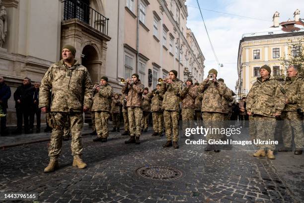 Military band plays during a funeral ceremony for the fallen Ukrainian defenders killed by Russian troops on November 22, 2022 in Lviv, Ukraine....