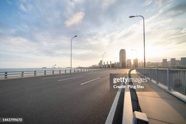 empty streets, cities, sky, clouds, light, asphalt roads - media center foto e immagini stock