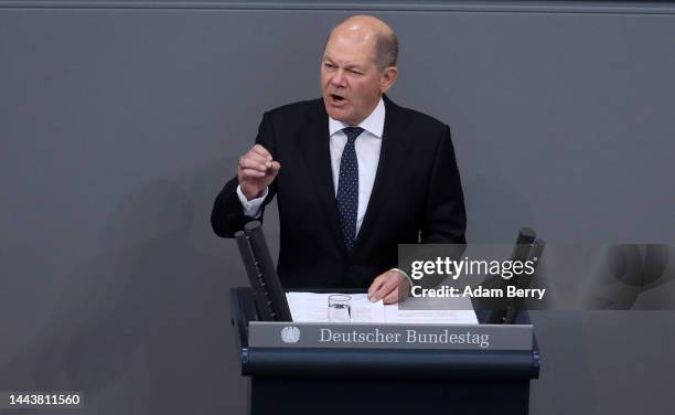 German Federal Chancellor Olaf Scholz speaks as he attends a debate over the country's 2023 federal budget in the Reichstag, seat of the Bundestag,...