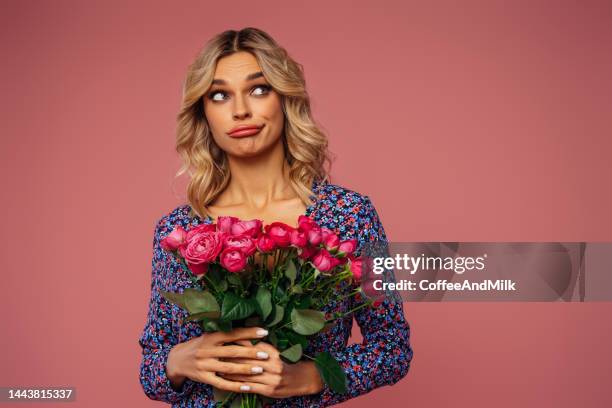 beautiful woman with a bouquet of flowers - sad present stock pictures, royalty-free photos & images