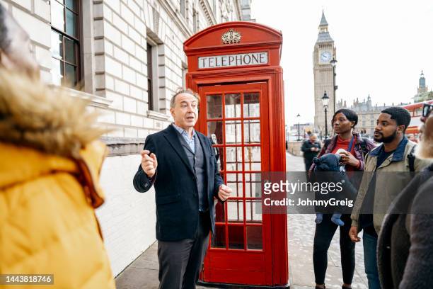 black family on walking tour of london with guide - history lesson stock pictures, royalty-free photos & images