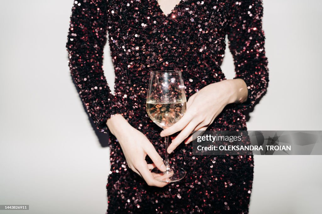 Close up of woman hands with champagne glass