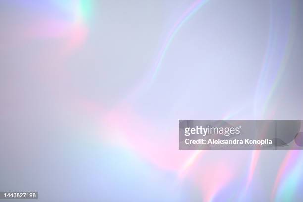 surreal aura rainbow laser light refraction texture overlay effect on white wall - glass shadow stockfoto's en -beelden