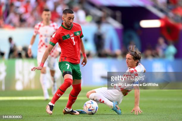 Hakim Ziyech of Morocco controls the ball against Luka Modric of Croatia during the FIFA World Cup Qatar 2022 Group F match between Morocco and...