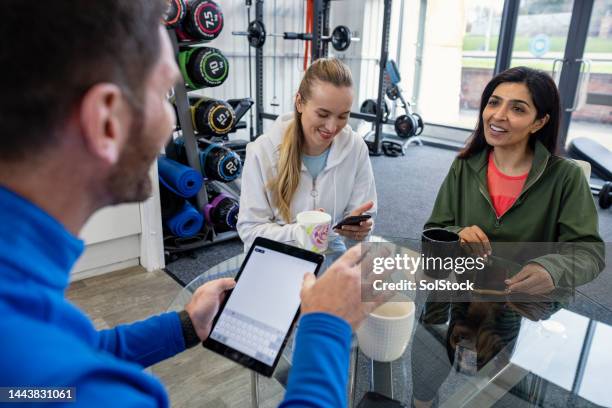 signing up to the gym - leisure facilities stock pictures, royalty-free photos & images
