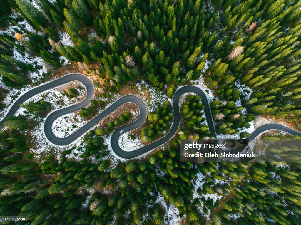 Aerial view of winding road through Dolomites in autumn