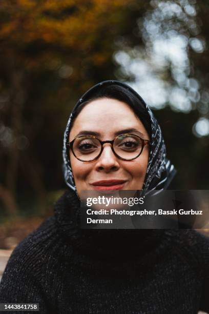 portrait of a beautiful woman with a fashionable elegant headscarf and eyeglasses - turtleneck stock pictures, royalty-free photos & images