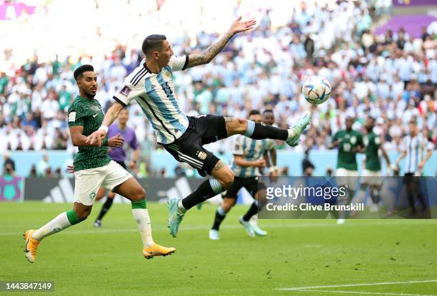 Angel Di Maria of Argentina attempts to control the ball against Salem Al-Dawsari of Saudi Arabia during the FIFA World Cup Qatar 2022 Group C match...