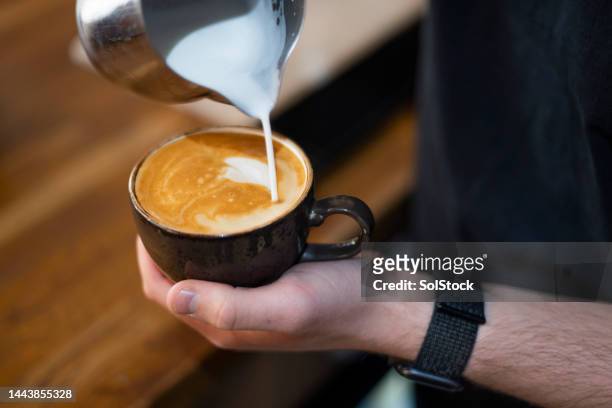 making the perfect cup of coffee - barista coffee milk stock pictures, royalty-free photos & images