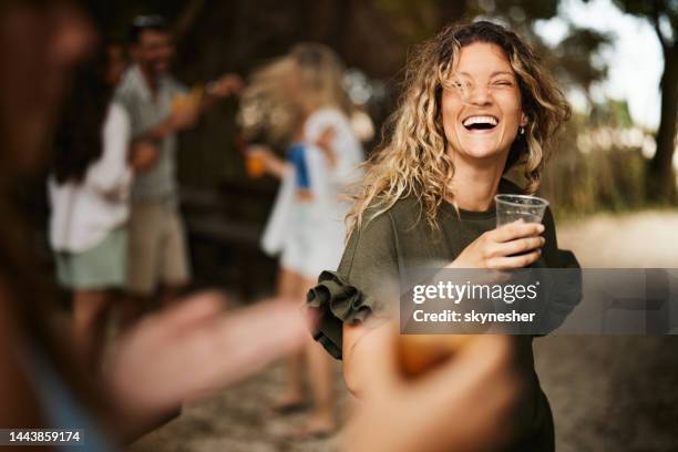 young carefree woman having fun at the outdoor party. - outdoor party imagens e fotografias de stock