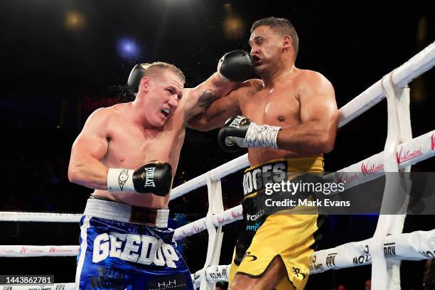 Paul Gallen throws a punch at Justin Hodges during their heavyweight fight at the Aware Super Theatre on November 23, 2022 in Sydney, Australia.